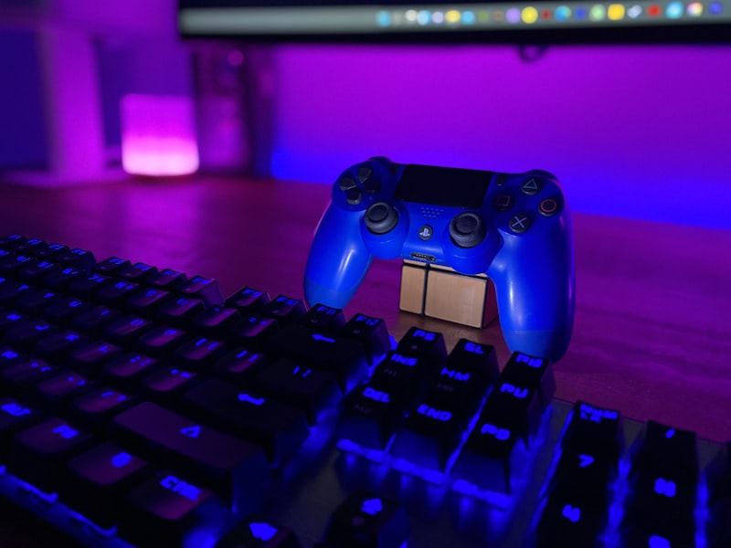 A glowing controller held in low light